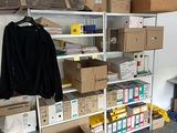 a room filled with boxes and boxes on the shelves