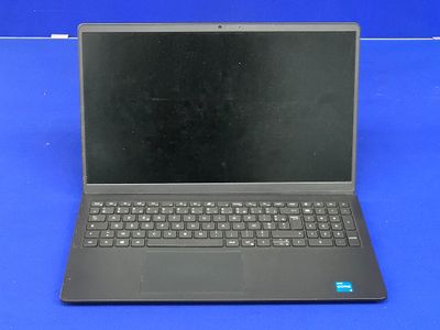 un ordinateur portable ouvert posé sur une surface bleue