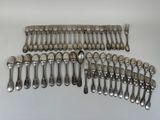 an assortment of silverware including spoons, forks and spoons