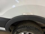 a close up of a white car with a sticker on the side of it