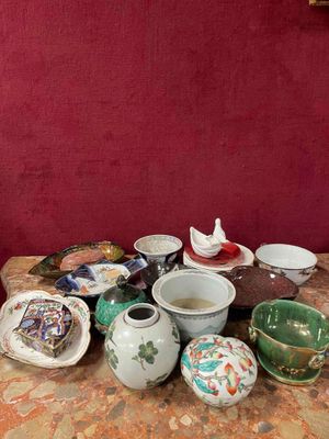 a table with a bunch of bowls and cups on it