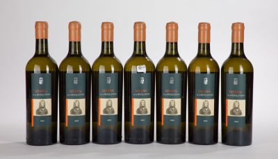 six bottles of wine sitting next to each other on a white surface