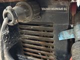 a close up view of a car ' s air conditioner with a hose attached to it