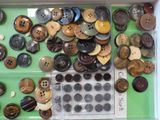 many buttons in a box on the table