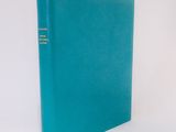 a blue book sitting on top of a white table