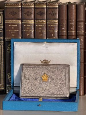 a blue box with a gold crown on top of it