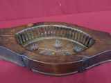 an old wooden ashtray on a red background