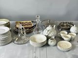 a table with a lot of dishes and cups on it
