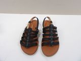 black leather sandals with braid straps on a white surface