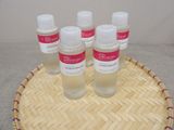 four bottles of hand sanitizer sitting on top of a bamboo tray