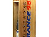 the wooden box holds a bottle of wine and a bottle of wine