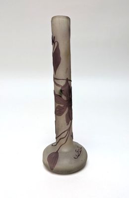 a vase with a flower design on it on a white surface