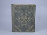 an old book with a decorative design on the cover