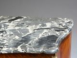 a marble top on the top of a wooden table