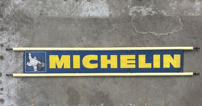 a sign that says michel on it on the side of a building