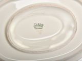 a close up of a plate with a name on it