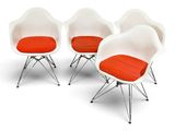 four white chairs with orange cushions and chrome legs on a white surface