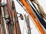 many different types of fishing rods and reels on the wall