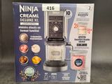 packaging of a blender sitting on top of a counter next to a blender