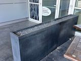 a planter that is sitting outside of a building