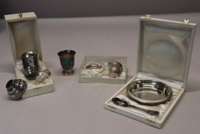 a silver plate and a silver cup and a silver spoon and a silver cup and a silver spoon and a silver cup and a silver cup and a silver
