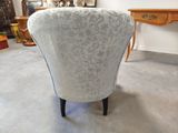 a chair that is sitting in the middle of a room
