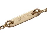 an image of a close up of a gold chain with a tag on it