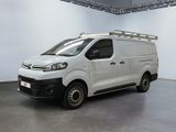 the white van is parked in a large room with white walls