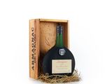 a bottle of wine in a wooden box with a label on it