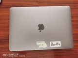 an apple macbook pro laptop sitting on top of a wooden table