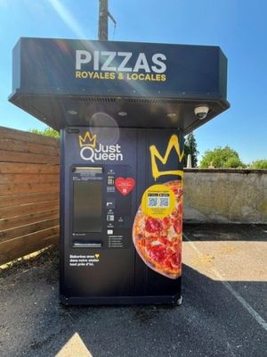 un distributeur automatique sur lequel est représentée une pizza