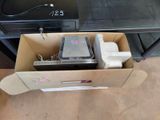 a box that has a computer in it on the floor