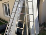 a ladder that is leaning against the wall of a house