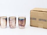 six shot glasses in a cardboard box with a box on the side