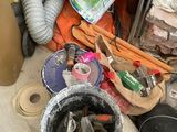 a pile of junk on the floor next to a pile of other items