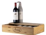 two bottles of wine in a wooden box with a bottle opener