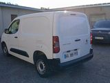a white van that is parked in a parking lot