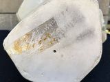 a close up of a piece of ice sitting on top of a table
