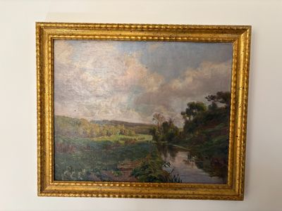 a painting hanging on the wall of a room