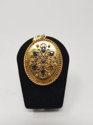a close up of a ring on a black stand with a white background