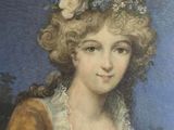 portrait of a lady with flowers in her hair, seated in a chair
