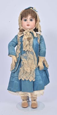 a doll that is wearing a blue dress and hat