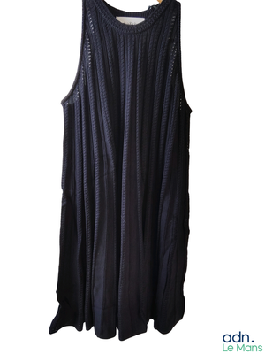 an image of a black dress hanging on a hanger