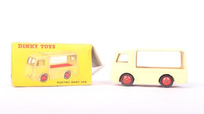 a small yellow toy truck next to a yellow box