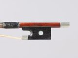 a close up of a violin bow on a white background