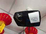 red and yellow lanterns hanging from the ceiling above a projector