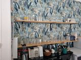 a shelf that has many glasses on it