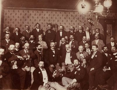 a group of men posing for a picture in a room