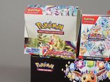a box of pokemon trading cards sitting on a table