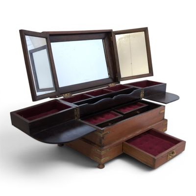 a wooden box with three drawers and a mirror in it